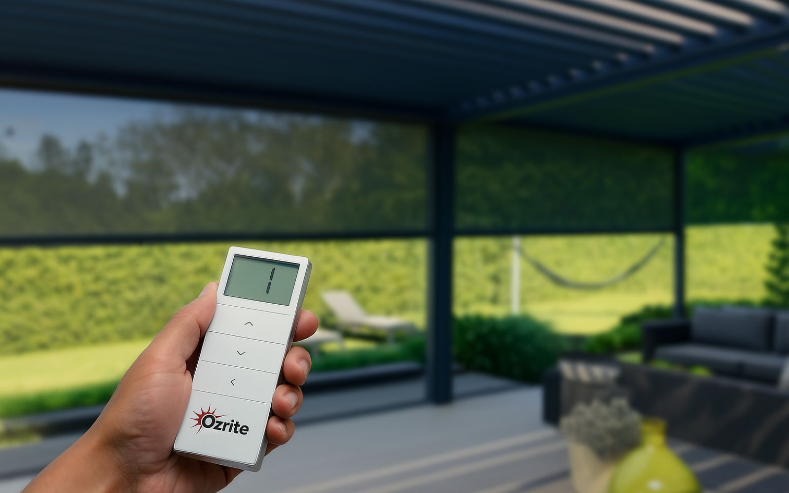 Hand holding remote control for motorised outdoor blinds on a modern Australian patio.