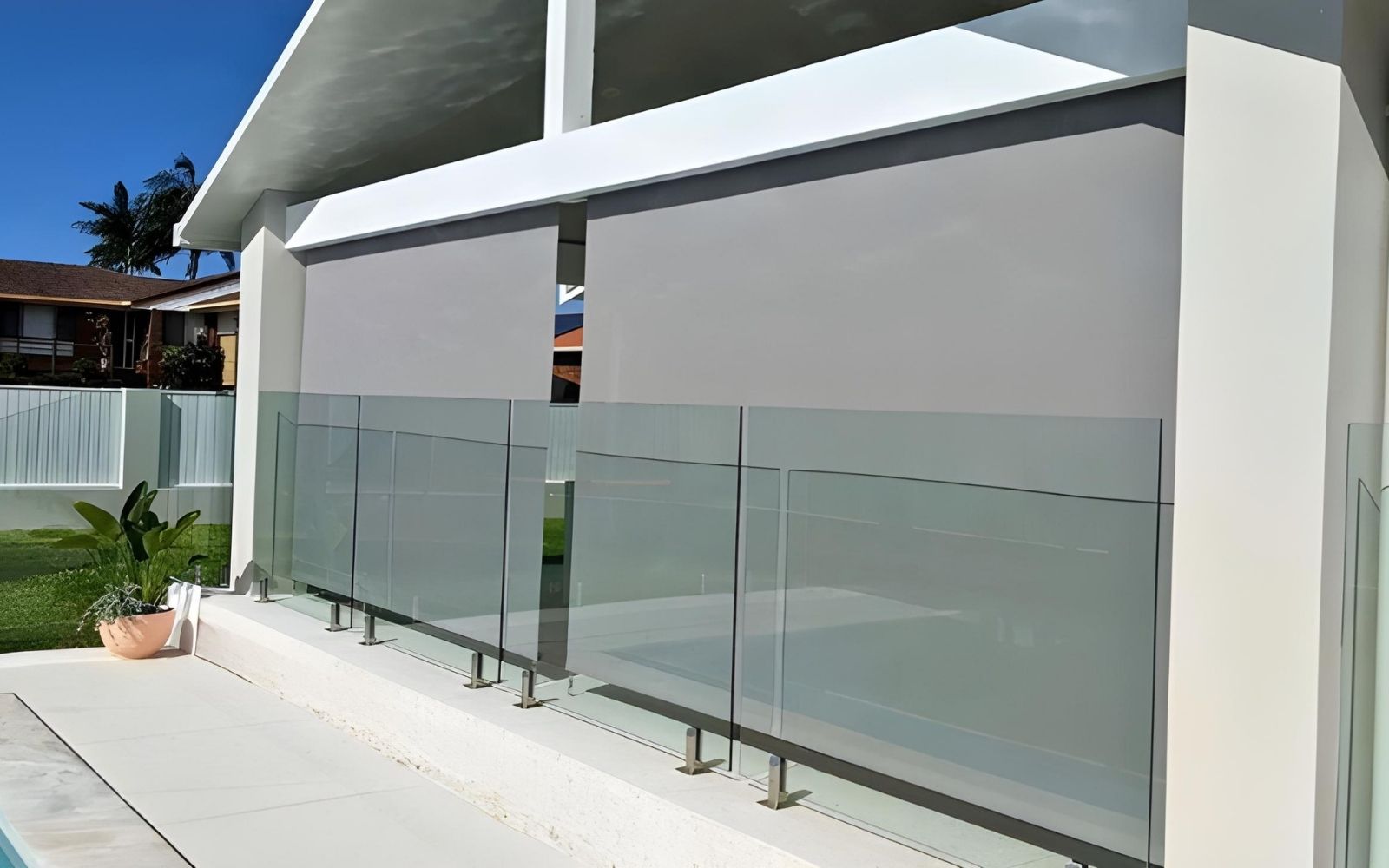 Privacy outdoor blinds on a modern Australian patio, blocking unwanted views while allowing light and airflow.