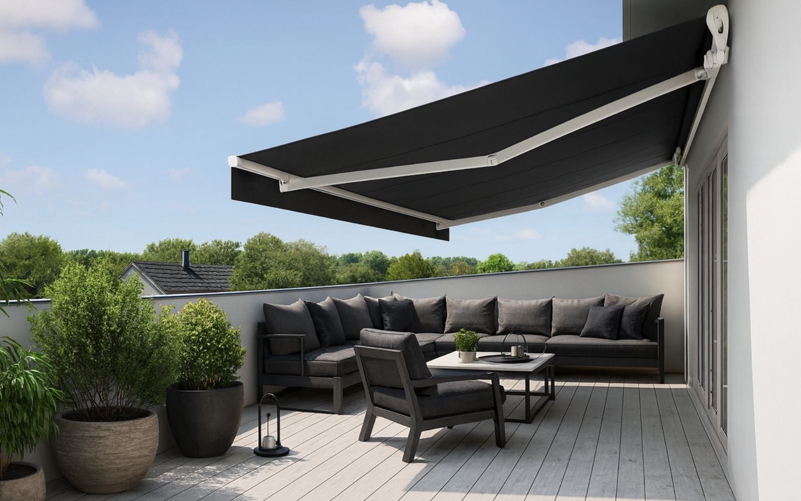 Outdoor patio with a modern folding arm awning providing shade for entertaining space – Ozrite Outdoor Blinds