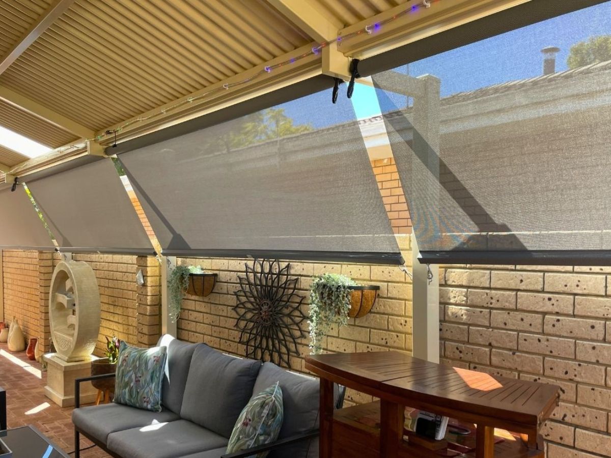 Outdoor blinds extending outdoor living area on a pergola for comfortable day and night use