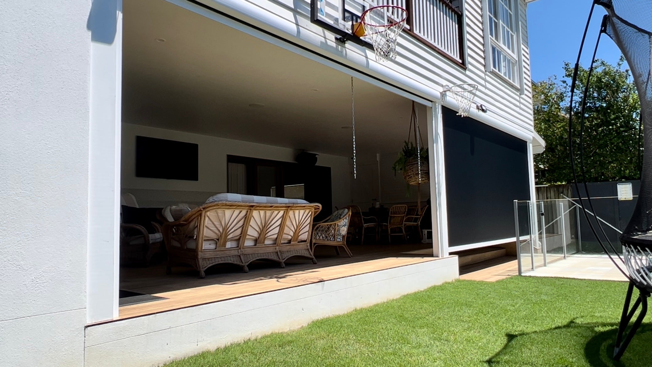Patio without outdoor blinds — exposed to sun, wind, rain, and insects.