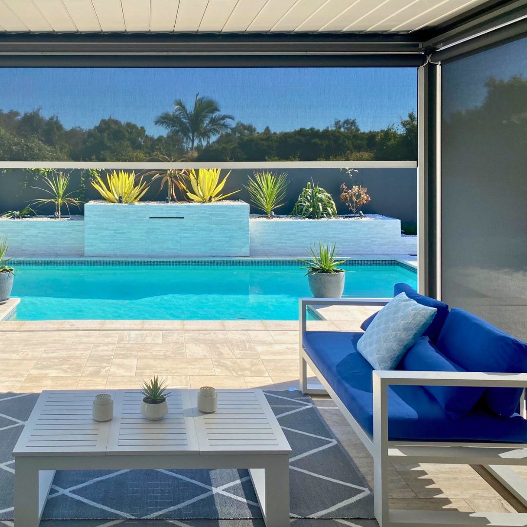 Ziplock outdoor blind enclosing a poolside patio