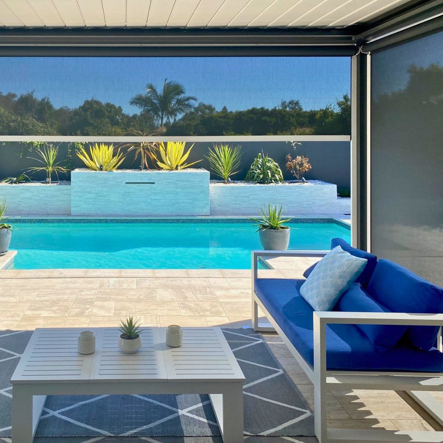 Ziplock outdoor blind enclosing a poolside patio