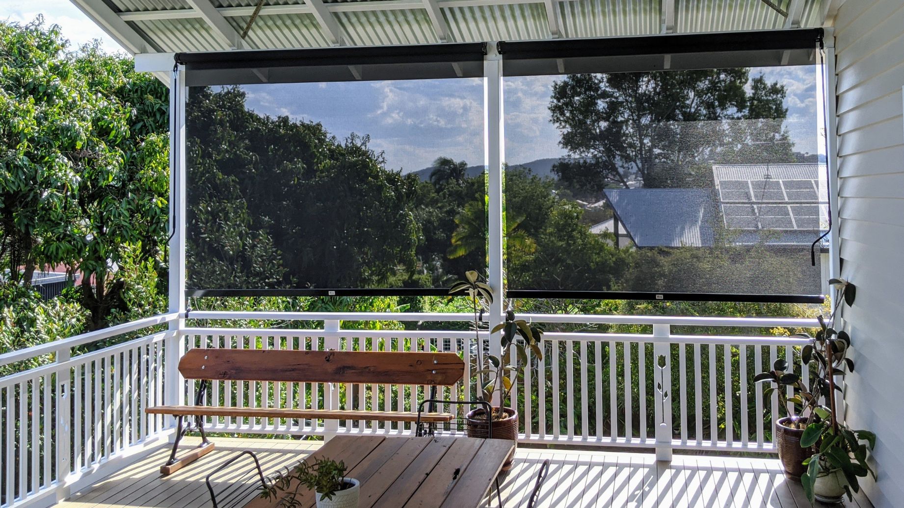 Ozrite outdoor blinds blocking 99% of sun, wind, rain, and insects — custom-made DIY blinds installed on a modern Australian veranda.