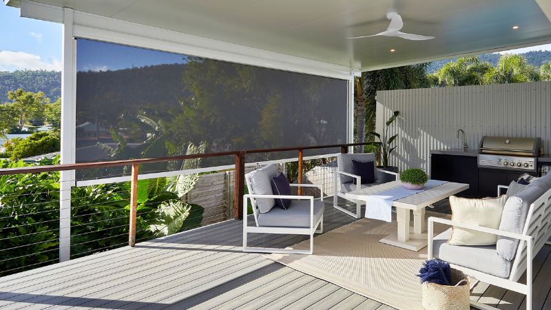 Step 3 of the Ozrite DIY outdoor blinds guide – installed blinds on a modern patio with outdoor furniture, showing the finished result.