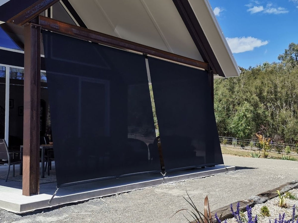 Outdoor blinds adding shade and privacy to a patio