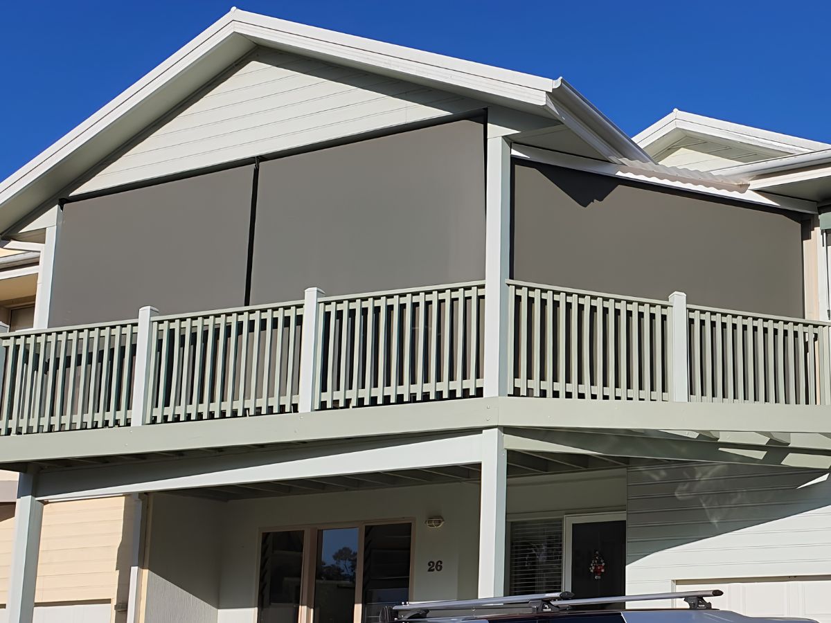 Premium charcoal outdoor patio blinds providing daytime privacy from a main road view