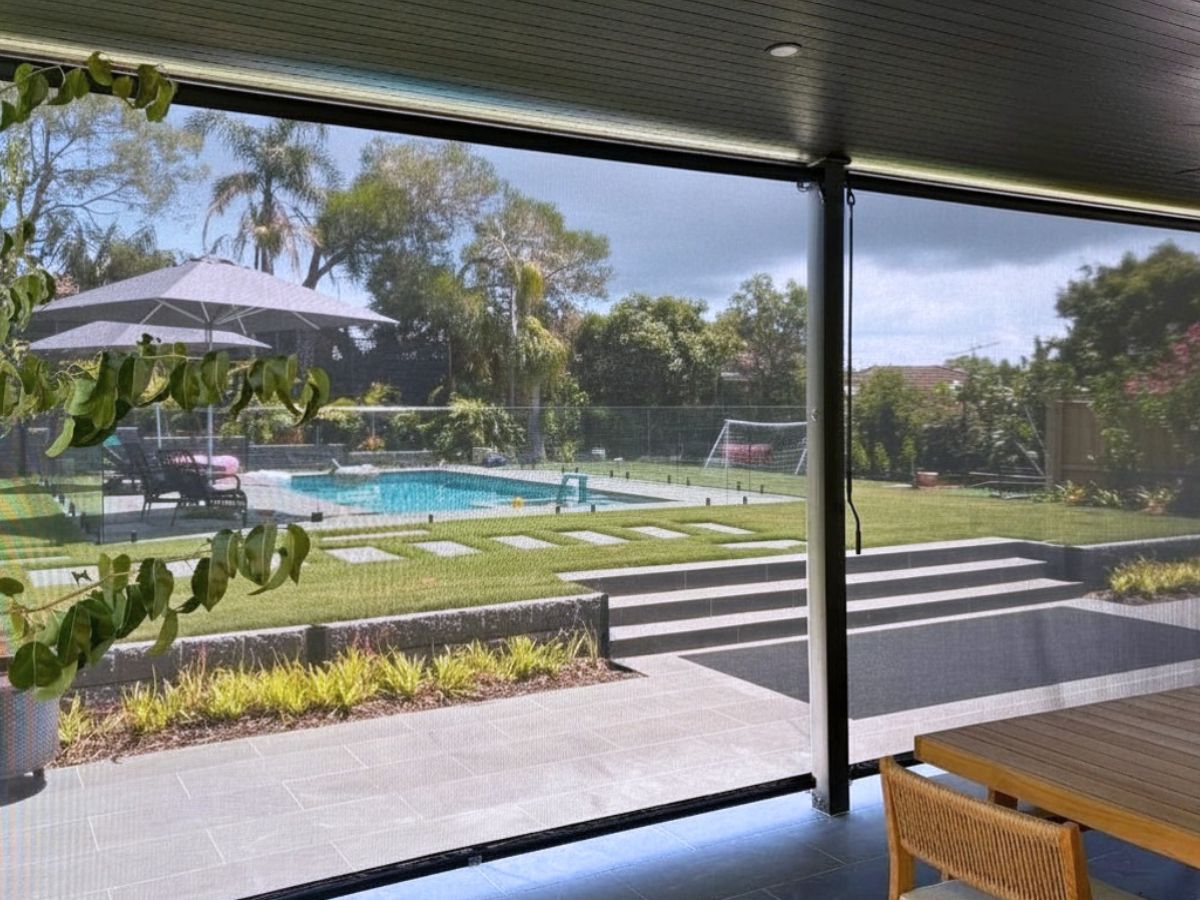 Outdoor blinds providing rain protection on a patio so the space can be used in changing weather